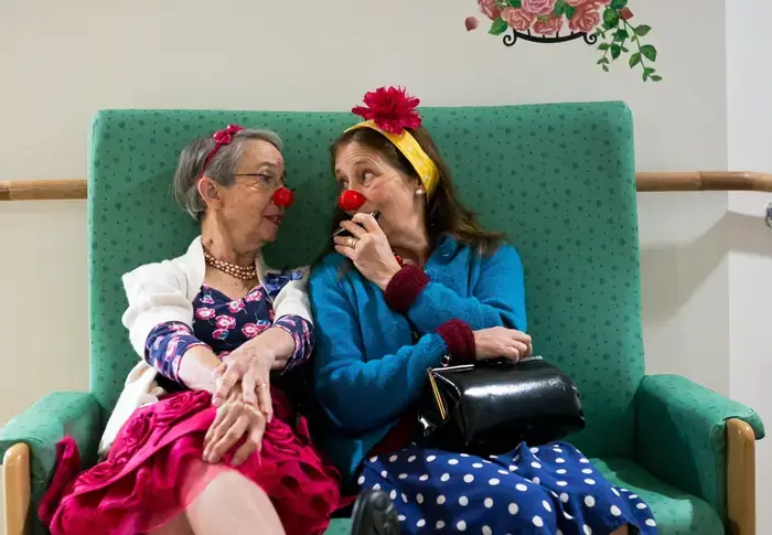 Two Elderflower ladies sharing smiles with red noses